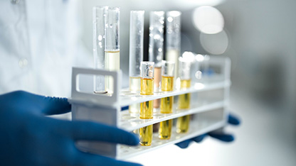 Scietntist with test tubes